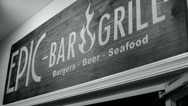 Hanging Commercial Signage and Wooden Restaurant Sign at the grand hotel in ocean city maryland