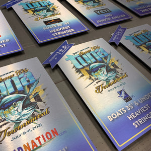 a photo of awards for the 2021 OC Tuna Tournament printed on brushed aluminum