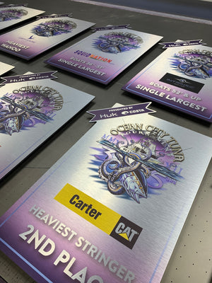 a photo of awards for the 2022 OC Tuna Tournament printed on brushed aluminum