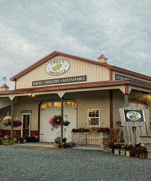 a photo of the Emily's Produce building with various signs mounted to the exterior
