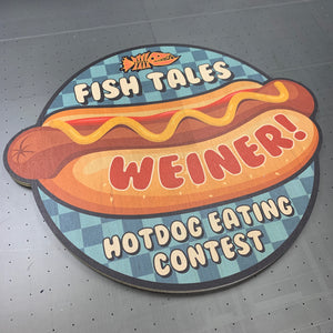 a photo of an award for the Fish Tales Hotdog Eating Contest on printed die-cut wood