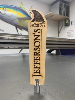 a photo of the Jefferson's tap handle made on laser engraved wood