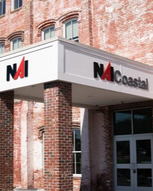a photo of both NAI Coastal signs mounted above the entrance