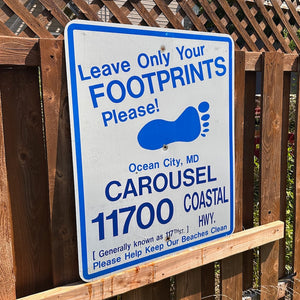 Carousel / 117th - Leave Only Your Footprints Sign