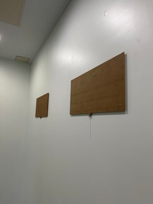 a photo of the system used to mount the acrylic rectangles to the wall