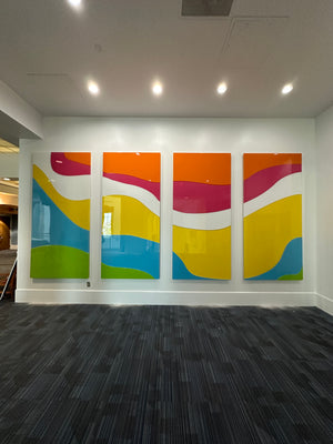 a photo of an abstract art piece made of multicolored rectangles mounted to a wall