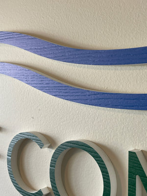 a closeup of the Ocean Pines Chamber of Commerce lettering mounted to a wall