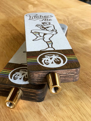 an angled photo of the Pitchers Ale tap handles