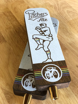 an angled photo of the Pitchers Ale tap handles
