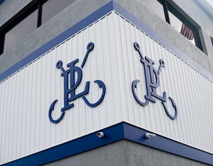 a photo of the Pure Lure logos mounted to the exterior walls