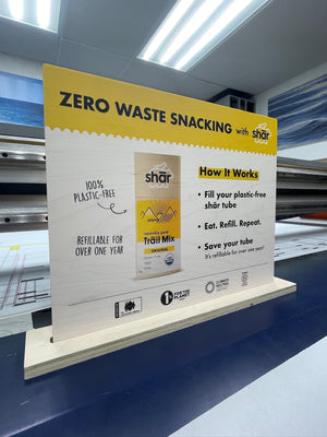 a photo of the Shar Snacks standee