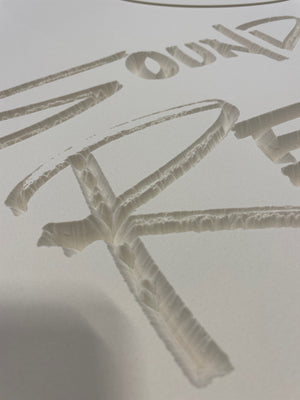 a closeup of the unpainted Sound Storm Records sign, showing the detail in the text