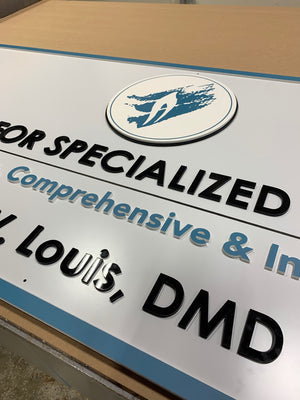 a closeup of the Centers for Specialized Dentistry sign showing the raised text and logo