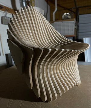 a photo of a strange looking abstract wooden chair