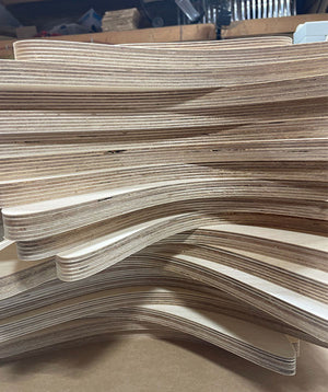 a photo of the stack of wooden shapes that will make up The Chair