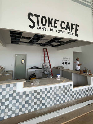 a photo of The Stoke's lettering mounted to a wall