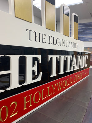 an angled photo of the final Titanic house sign showing the layers