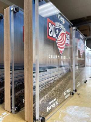 an angled photo of the 2025 USA Surfing Championship awards showing the raised acrylic layer