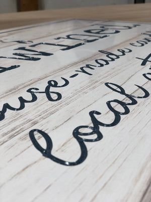 an angled closeup of the finished Unwined sign showing the detail in the lettering