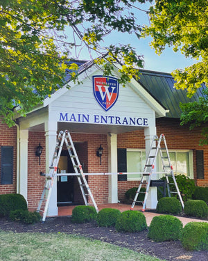 a photo of the Worcester Prep logo and lettering mounted above the entrance