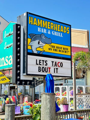 a photo of the lightbox sign for Hammerheads Bar & Grill