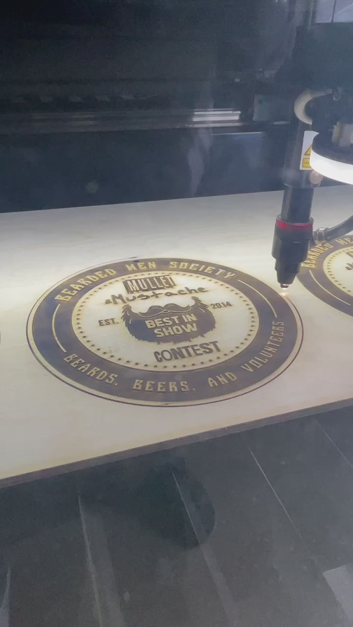 a video of an award for the Bearded Men Society being laser engraved